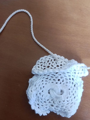 Small knitted pouch used, white