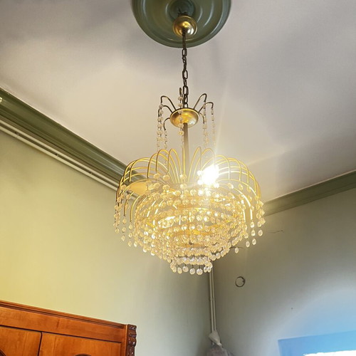Vintage gold chandelier with hanging crystals, waterfall style