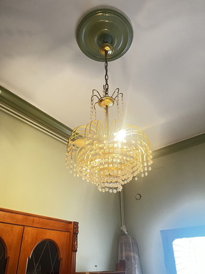 Vintage gold chandelier with hanging crystals, waterfall style