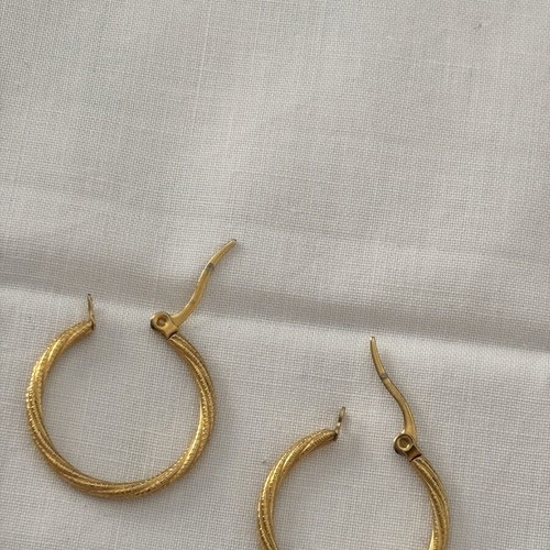 Iron golden rings with a twisted design.