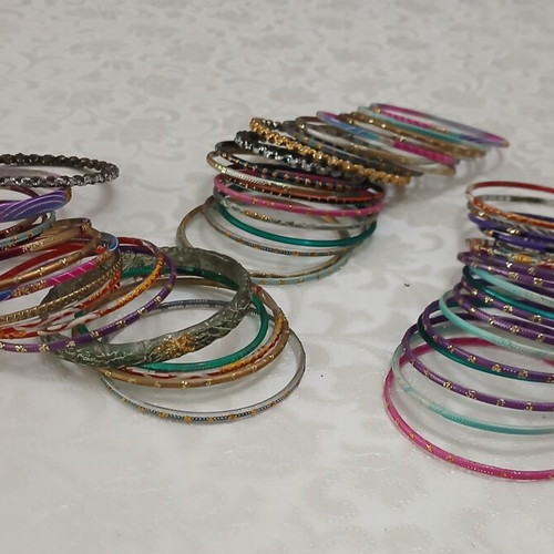 Indian glass bracelets like new, set of 54, colorful and decorated