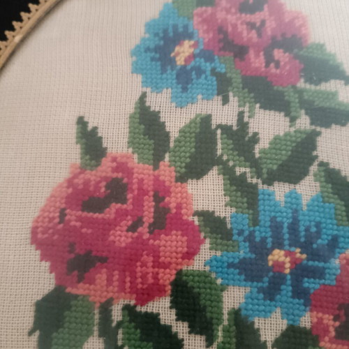Vintage handmade cross-stitch frame with velvet oval border used