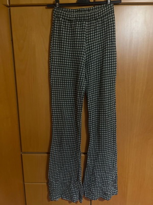 Bell-bottom pants elastic like new with pattern, size small, dark green with beige