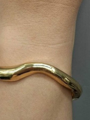 Gold-tone metal cuff bracelet, minimal design
