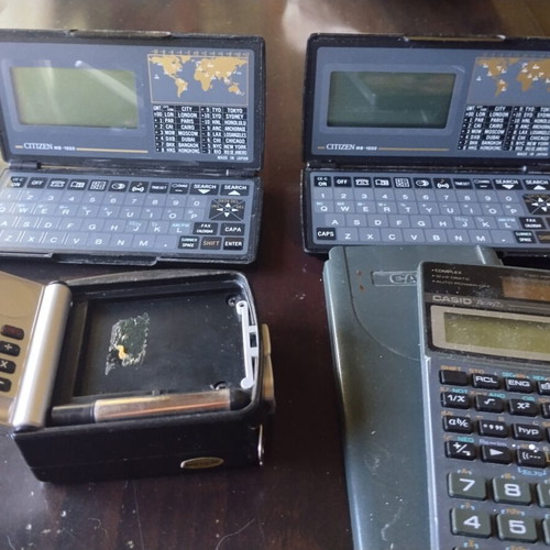 Vintage calculators and electronic organizers used, pack of 12
