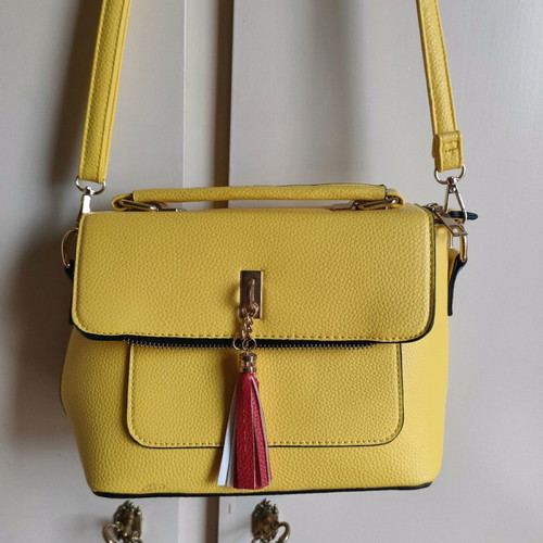 Yellow crossbody bag used with detachable strap