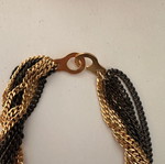 Necklace with intertwined chains like new, black and gold