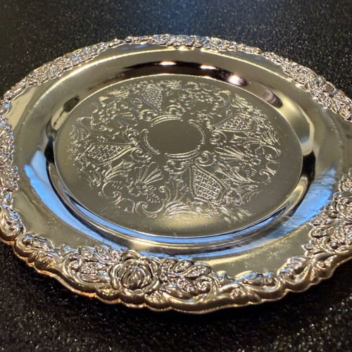 Silver-plated carved coasters like new