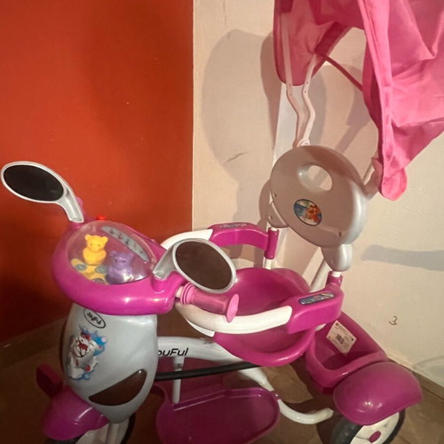 Tricycle like new with canopy, footrest and safety bar