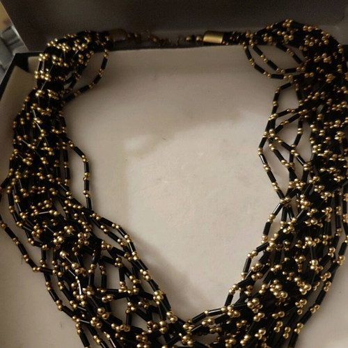 Accessorize necklace like new with black and gold beads