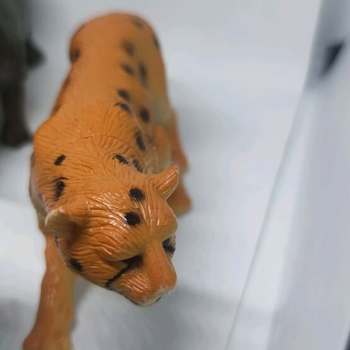 Plastic jungle animals and small dinosaurs used