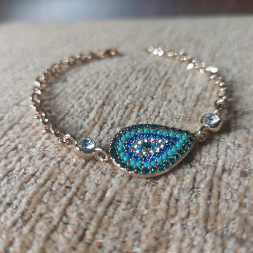 Gold bracelet new with eye and blue, turquoise, white stones