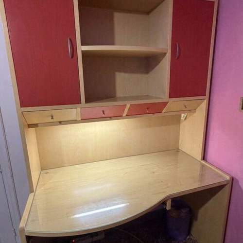 Desk-library for children's room used with glass surface and shelves