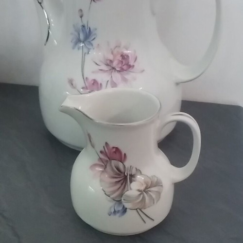 Porcelain tea set used with two teapots, creamers and sugar bowls