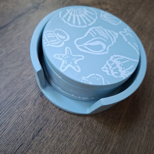 Handmade plaster coaster set with summer decoration and soft blue color