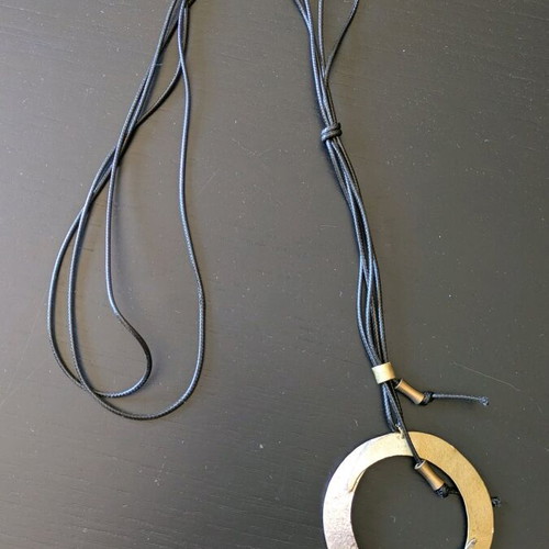 Long handmade necklace new with metal details and leather