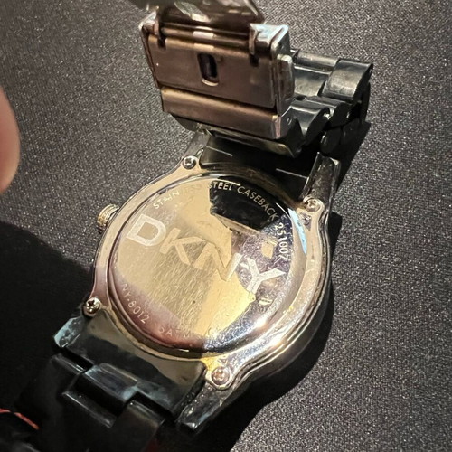 DKNY women's watch used with stones and black bracelet