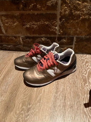 New Balance athletic shoes, size 38, gold