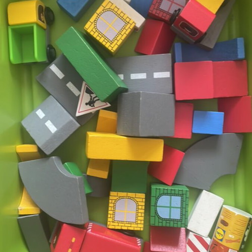 Wooden building blocks used with road and trucks