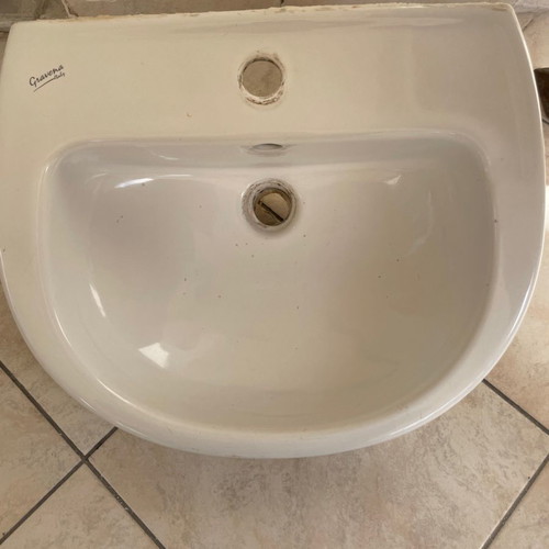 White bathroom sink used with minor small marks