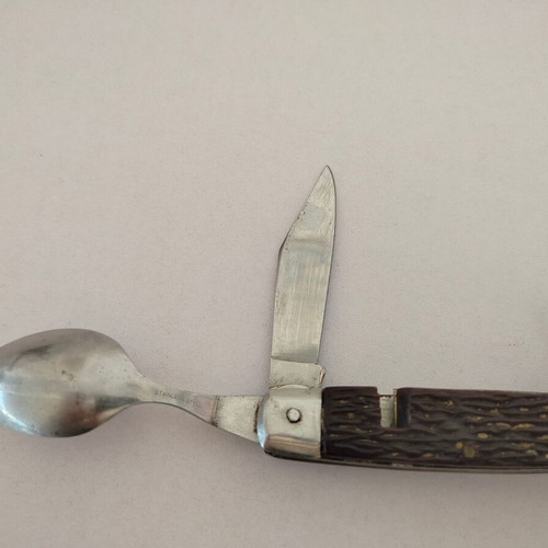 Vintage pocket knife with integrated fork and spoon, used