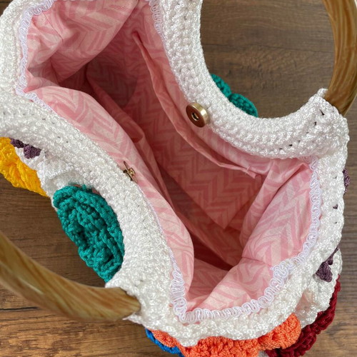 Handmade crocheted handbag with wooden handles and colorful flowers new