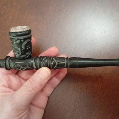 Handmade carved wooden pipe with stone inlay