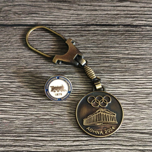 Railway retirees pin and Athens 2004 Olympic keychain set