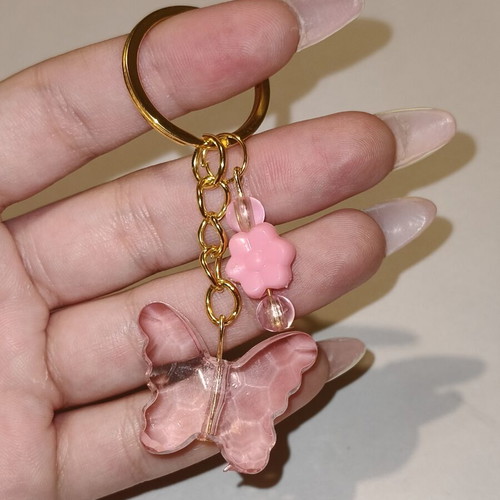 Handmade butterfly keychain in pink and gold stainless steel