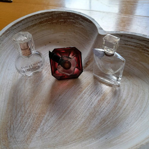 Miniatures of branded perfumes used, empty bottles