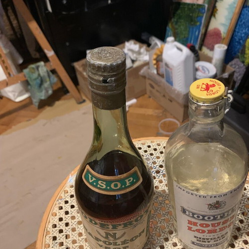 Hennessy cognac 1950 and gin 1960 bottles unopened