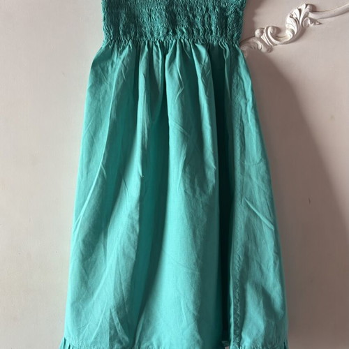 Strapless dress turquoise used with smocked bust