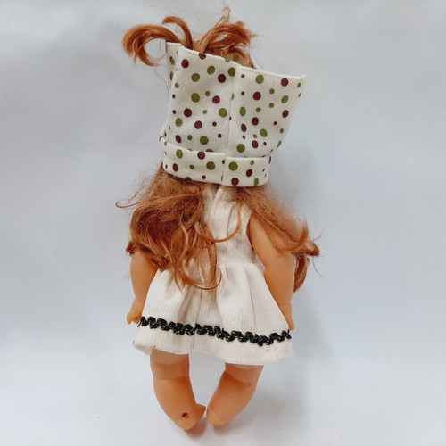 Vintage plastic doll 60s with open eyes, white knitted dress, tiara