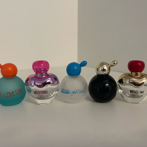 Collection of 44 empty genuine perfume bottles, various brands