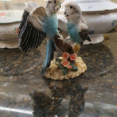 Figurine of two beautiful parrots on a branch like new