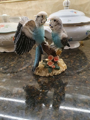 Figurine of two beautiful parrots on a branch like new