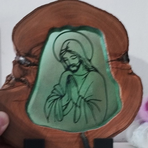 Handmade religious icon on natural wood slice with resin finish