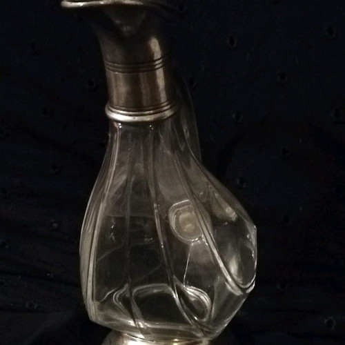 Glass duck-shaped carafe used with pewter spout