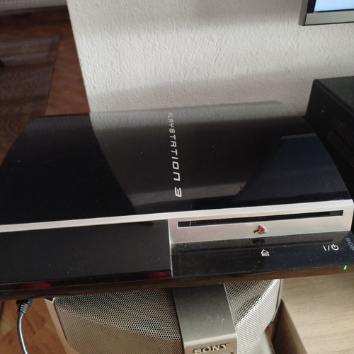 PlayStation 3 console used with controller, charging cable and 6 games