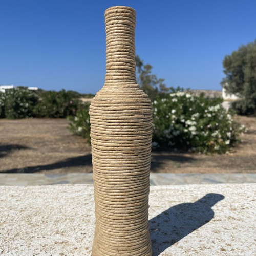 Decorative bottle wrapped with natural rope