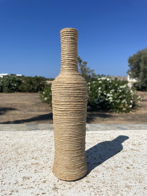 Decorative bottle wrapped with natural rope