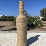 Decorative bottle wrapped with natural rope