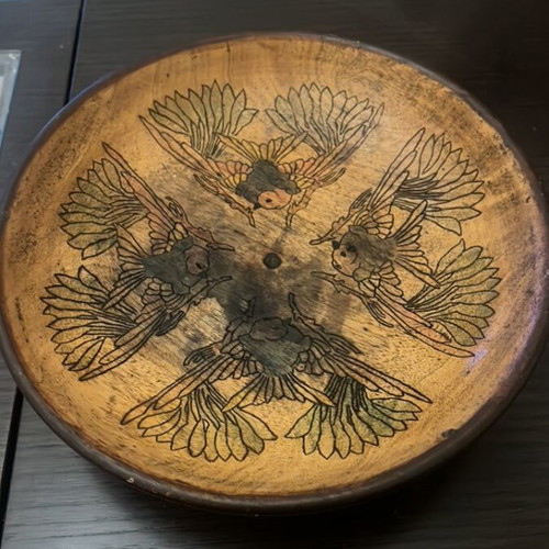 Handmade wooden bowl used with embossed bird decoration