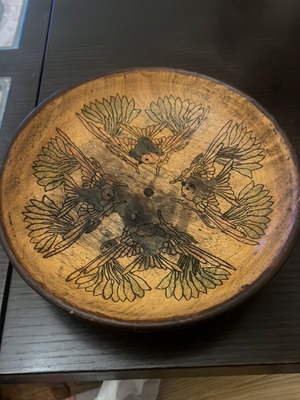 Handmade wooden bowl used with embossed bird decoration