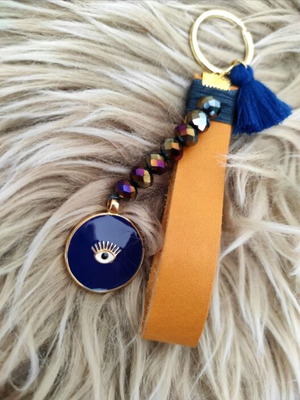 Leather keychain with eye and crystals like new, blue
