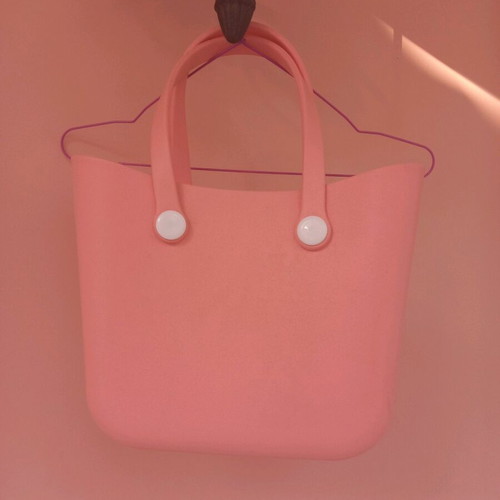 PVC bag pink with white buttons like new, handheld style