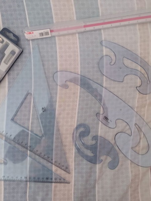 Drafting tools set new with rulers, compasses, and templates