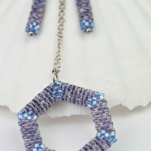 Custom-made jewelry set in light blue tones with hexagonal pendant