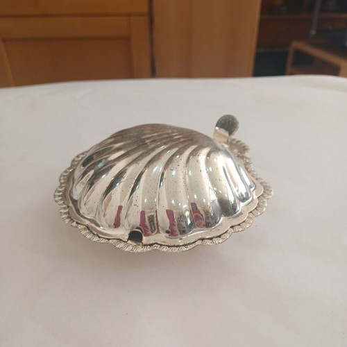 Vintage shell-shaped serving dish used with wear marks