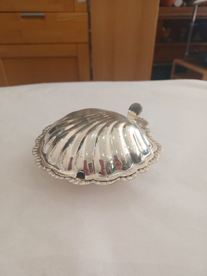 Vintage shell-shaped serving dish used with wear marks